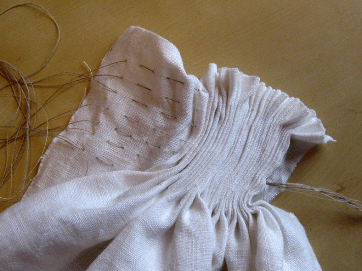 The fabric pulled together using the gathering stitch.