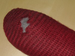Nalbounding sock with annoying hole.